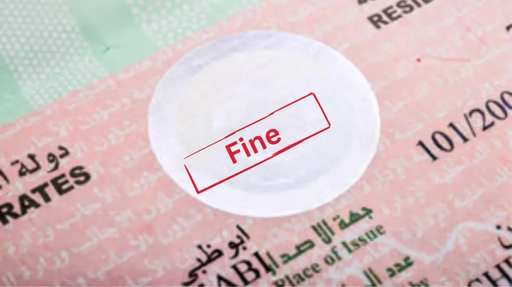 Overstay Fine in UAE displayed on a UAE visa document with a red stamp indicating penalty.